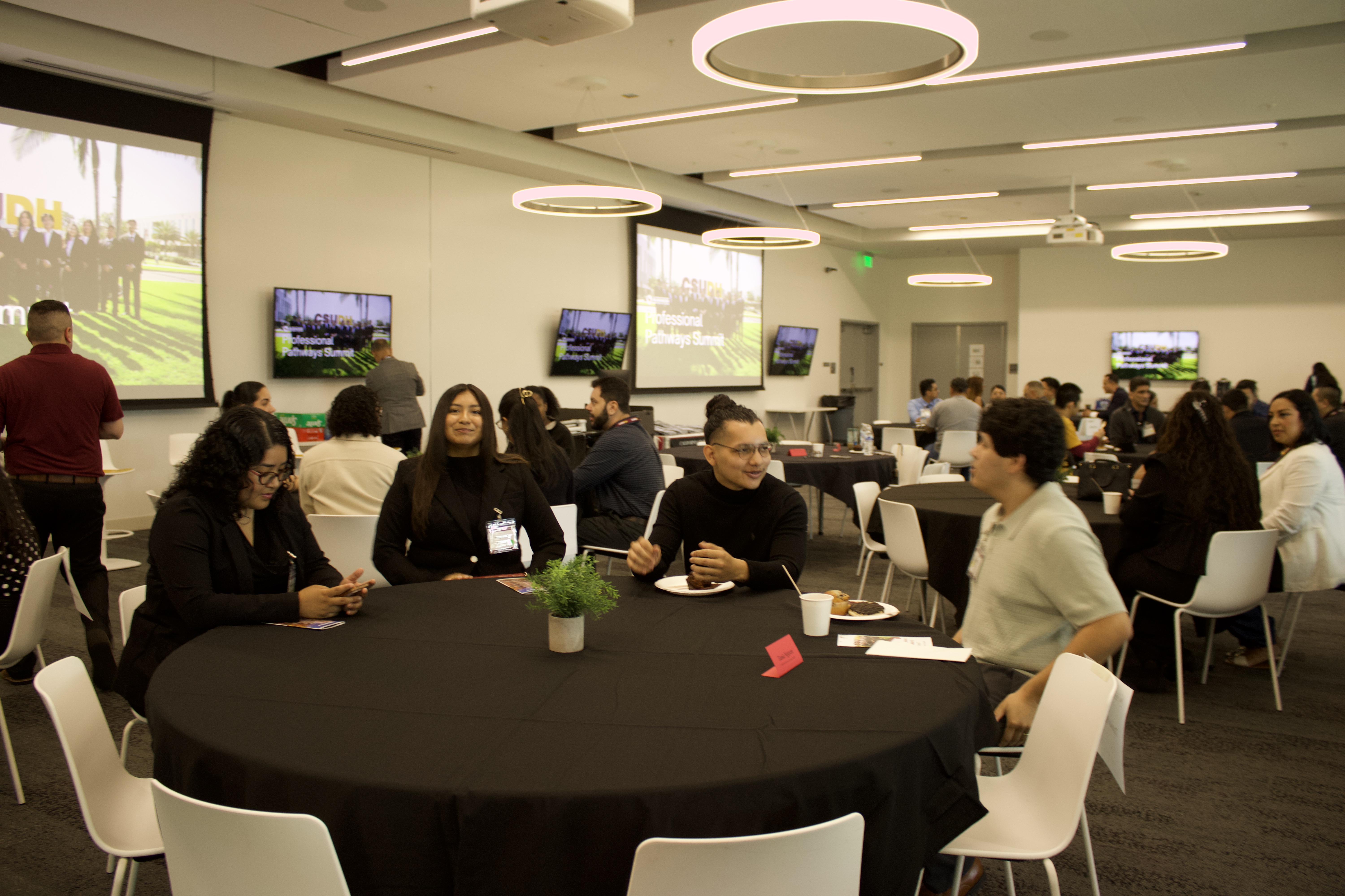 LSBA members seated at a round table networking during the CSUDH Professional Pathways Summit.